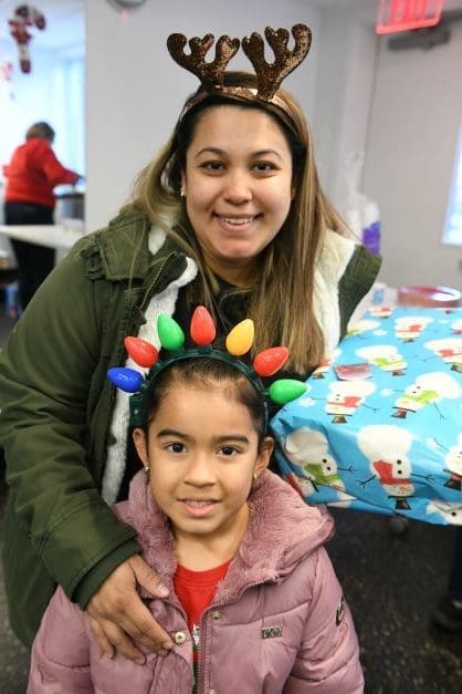 Mother and daughter smiling for Christmas picture