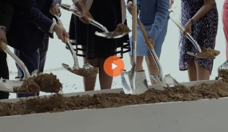 True-Ground-Partner-with-Real-Estate-Unity-Homes-at-Ballston-Grand-Opening-Video@2x Screenshot of a video showing people inaugurating a construction site.
