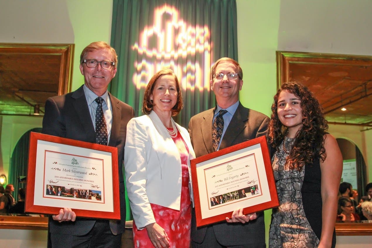 Affordable housing award recipients with framed certificates