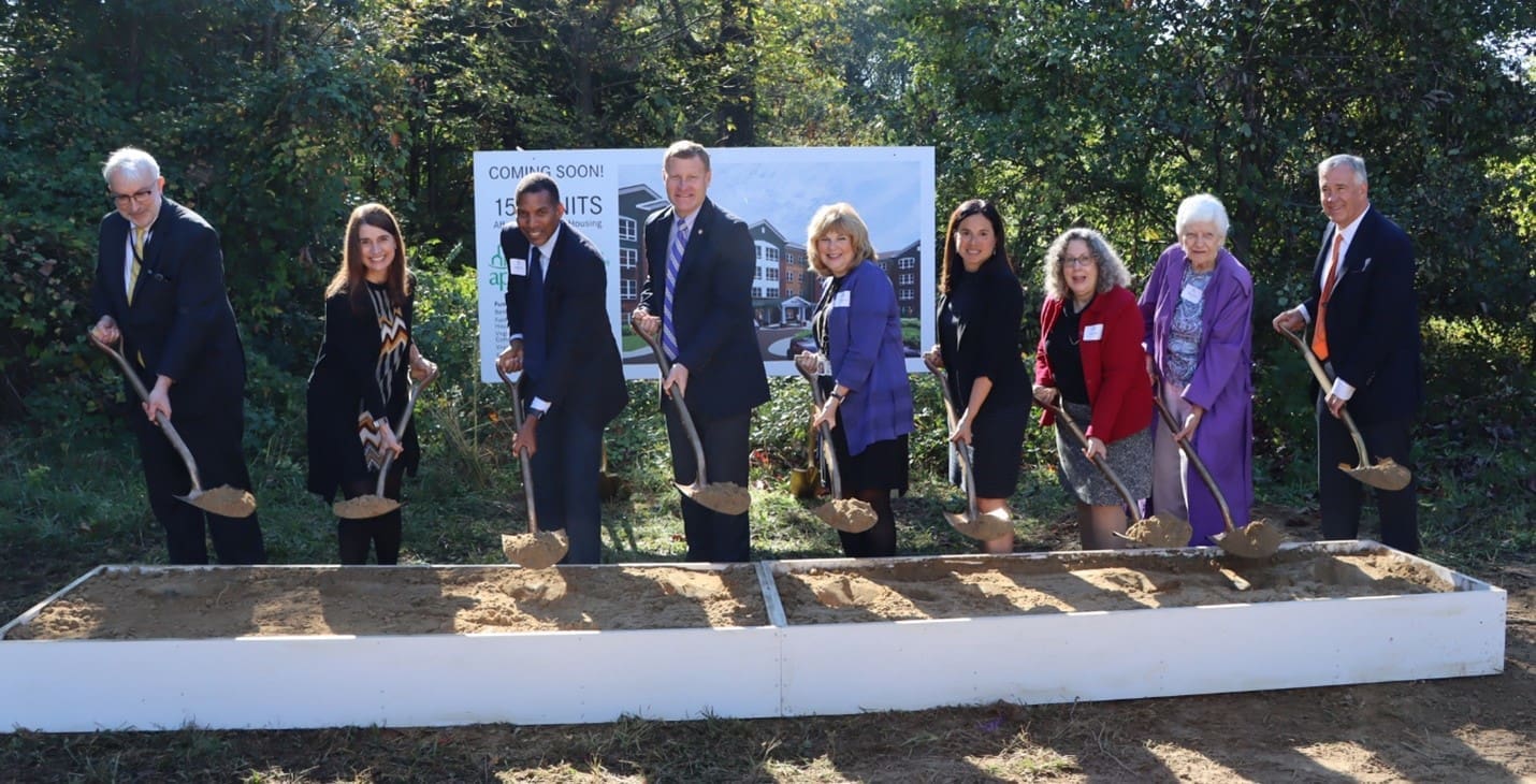 Partners stand with shovels at the ceremonial groundbreaking of Oakwood