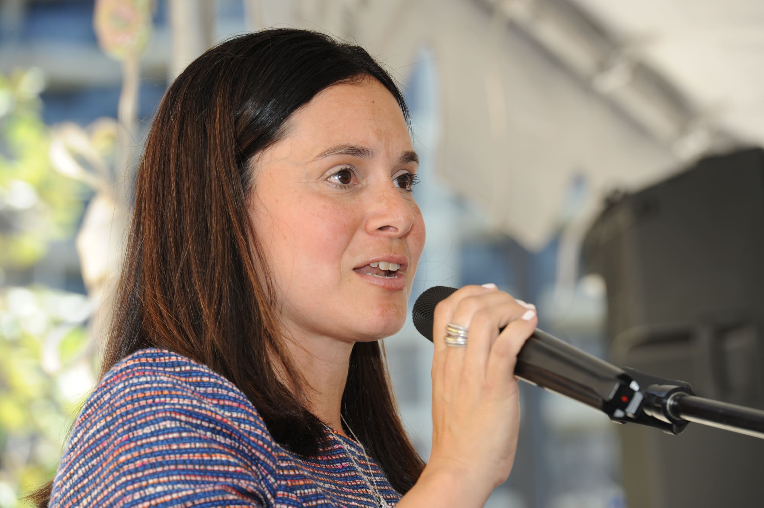 Carmen Romero speaks at the grand opening of Queens Court, June 2021