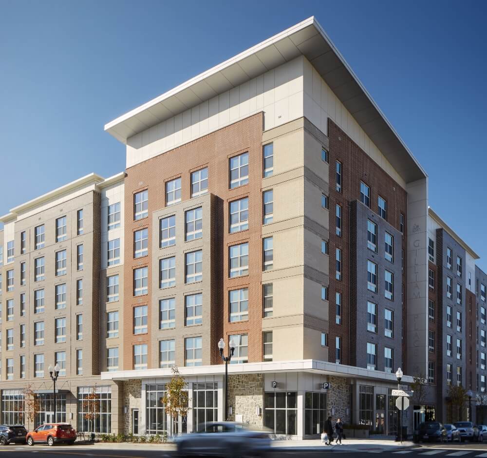 Exterior view of a multi-story residential building with a modern design.