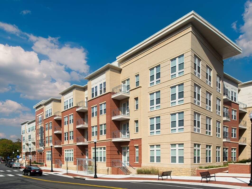 Exterior view of a multi-story residential building with a modern design.