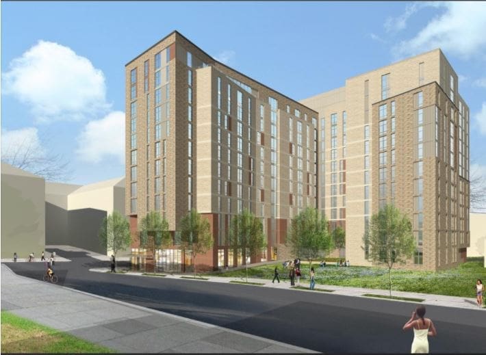 Proposed residential complex with green accents and surrounding greenery
